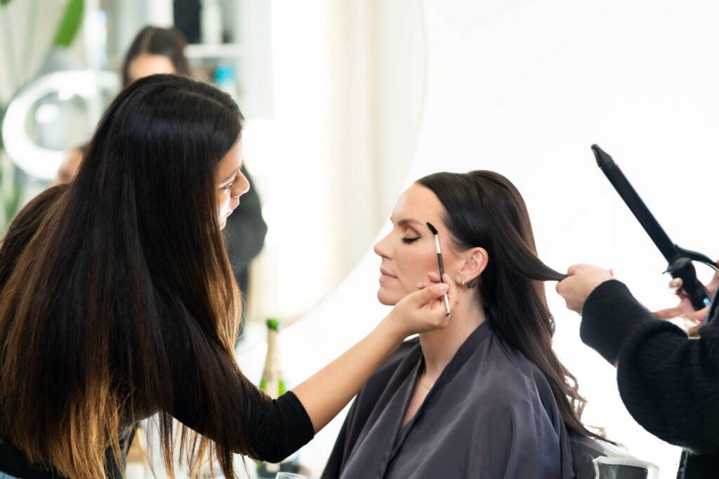 Karla creating a bridal makeup look